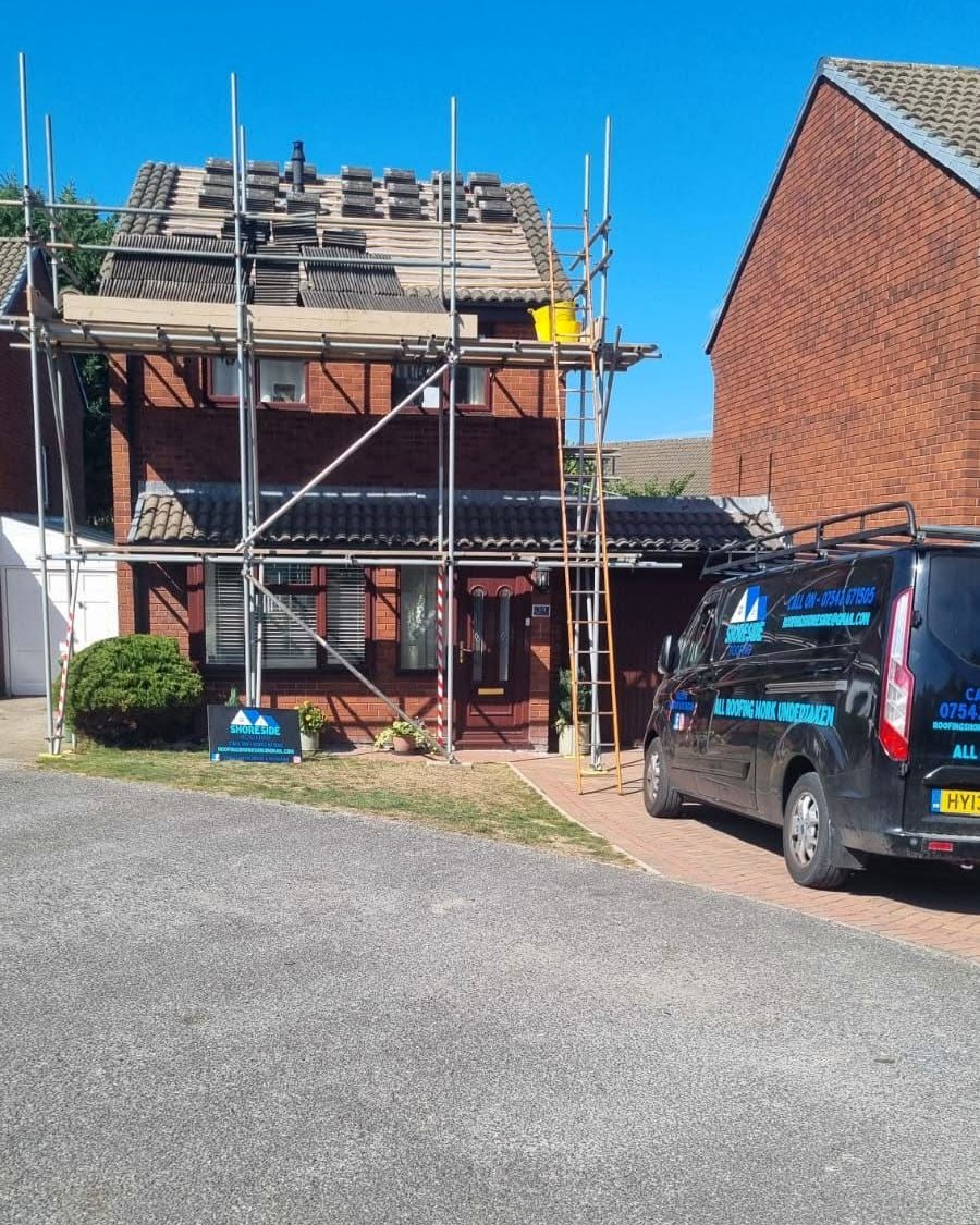 Shoreside Roofing van and scaffold on a job