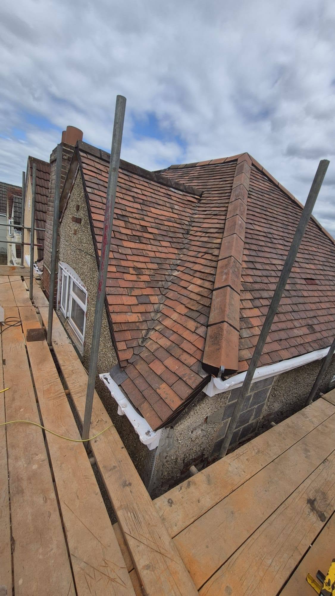 Clay plain-tile re-roof with new hip ridge
