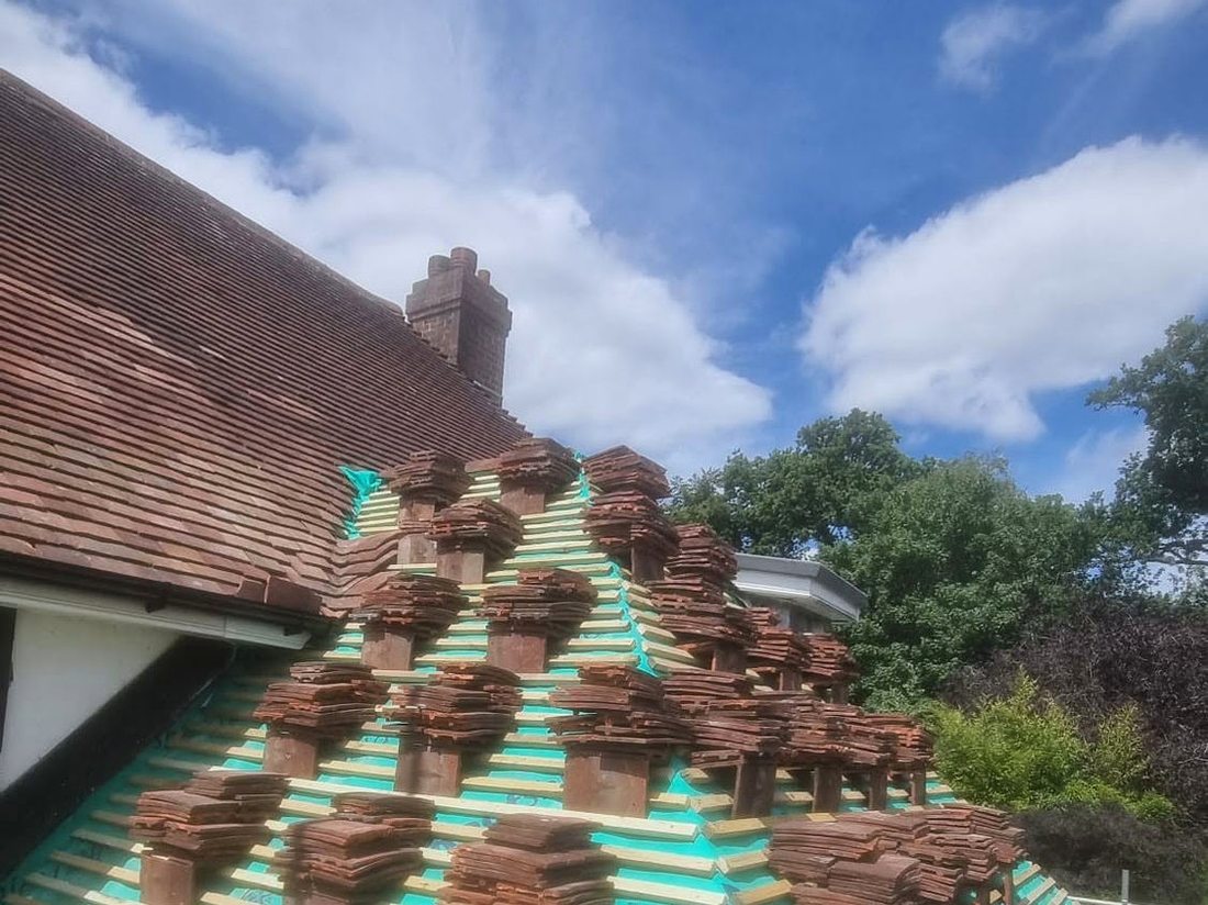 Roof stripped to felt and battens