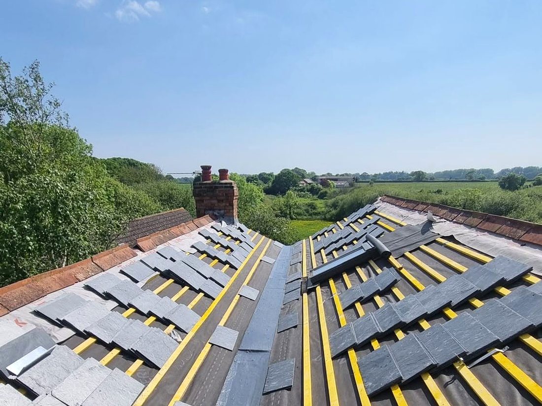 New slate roof being installed