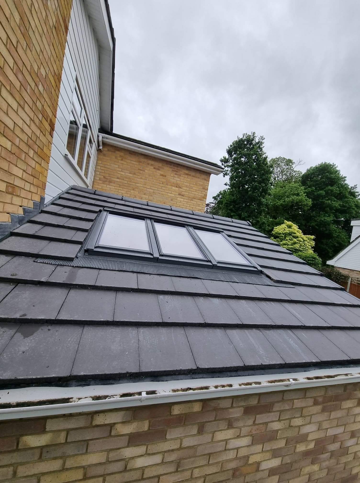 Triple Velux bank fitted in a re-tiled roof